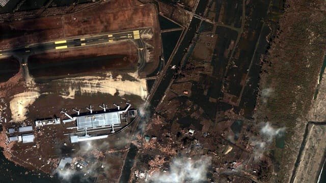 Satelliteimagesphotodevastationearthquaketsunamisendaiairport2